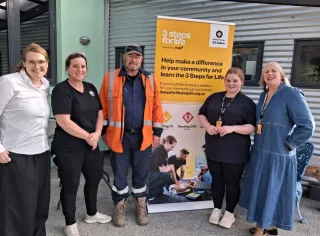 Five Rivers Café AED Now Outside Round Clock